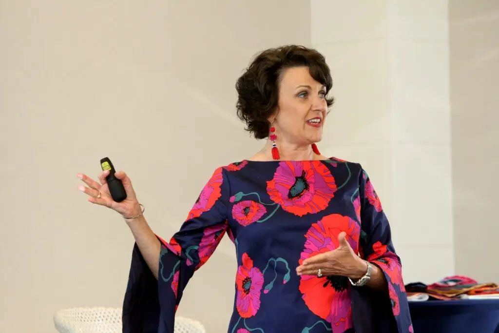 Marcella Scherer speaking to an audience about women’s leadership and personal transformation